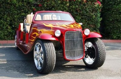 Luxury golf cart in front of mansion
